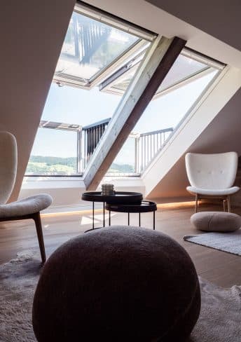 Suite Nine with reclaimed wood wall above the bed