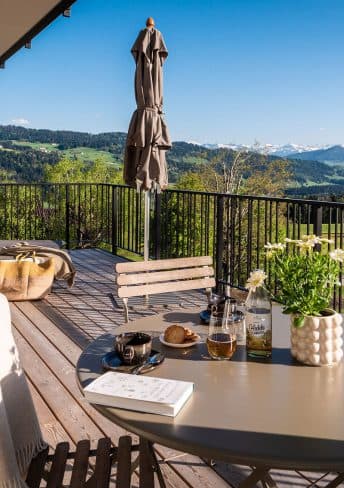 Terrace of Suite Three with sun loungers and alpine view