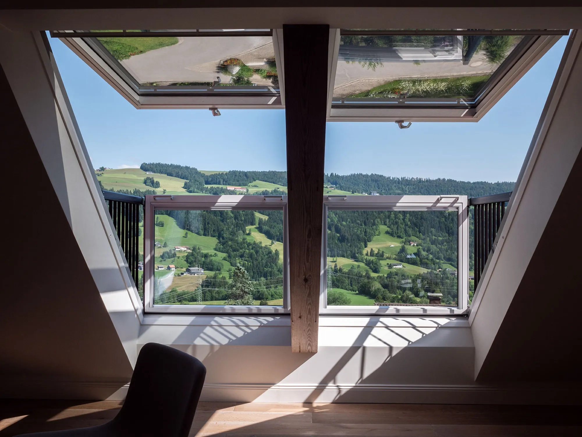 Open dormer window in Suite Seven with a wide view over the Westallgäu